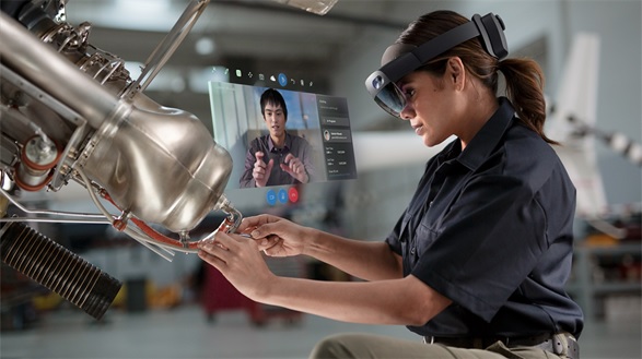 [image]* Simulated image of a field maintenance technician wearing HoloLens 2 and communicating with a remote expert via Dynamics 365 Remote Assist