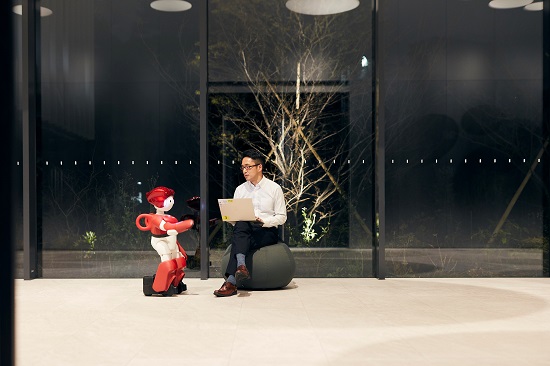 [image]Image of the Robot Speaking to an Employee Working Overtime, During Office Surveillance Patrol Duties