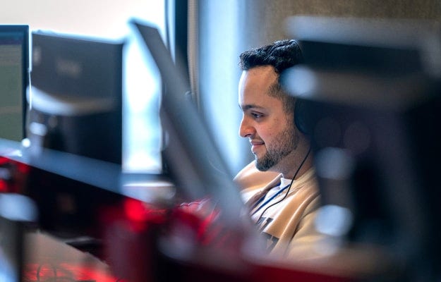A person looking at a computer screen