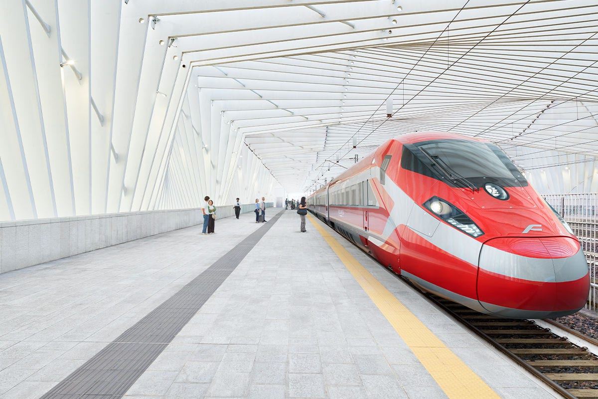 A red ERT1000 Hitachi train stopped at a station