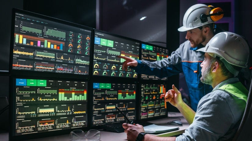 Workers looking at data