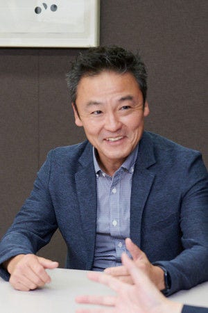 画像: 三溝勝広氏（日立製作所 インダストリアルデジタルビジネスユニット デジタルソリューション事業統括本部 エンタープライズソリューション事業部 事業主管）