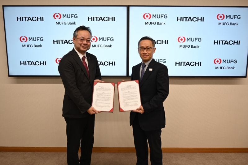 Hitachi and MUFG signing a partnership