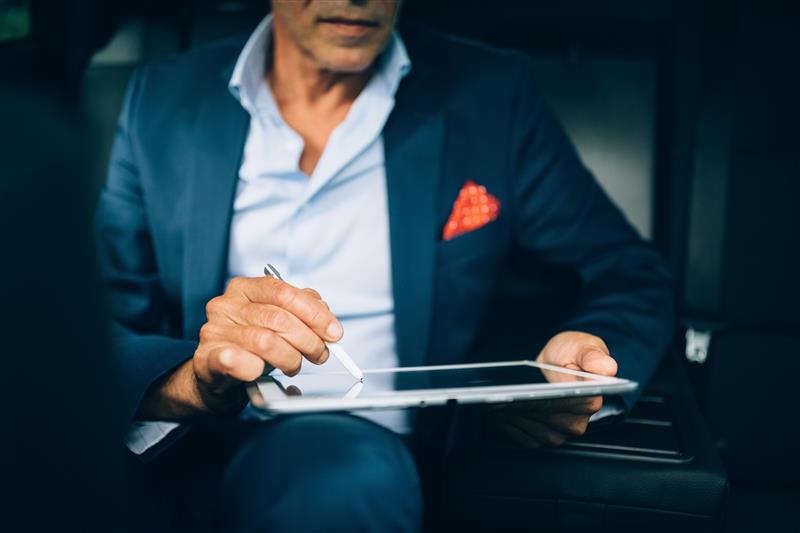 man reading the Hitachi corporate presentation