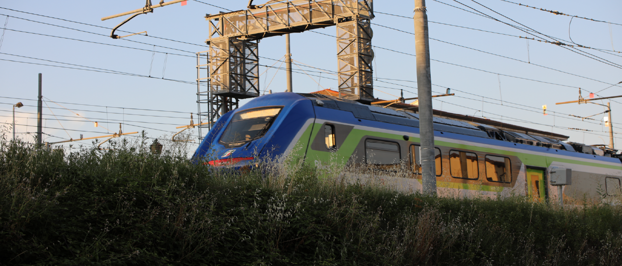 Hitachi Blues Train traveling on a track with overhead wires