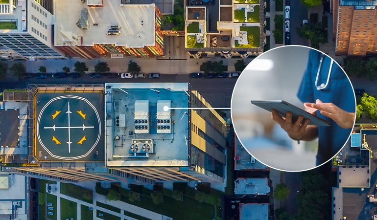 Aerial view of a building. A circular inset zooms in on a health professional