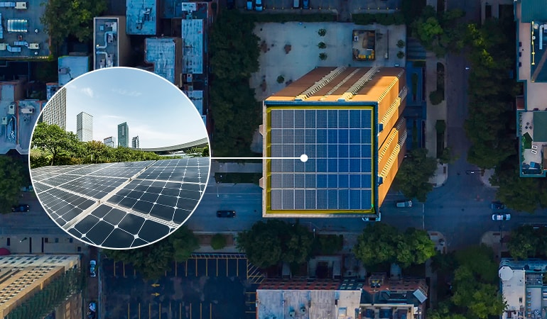 Aerial view of a city building. A circular inset zooms in on solar panels