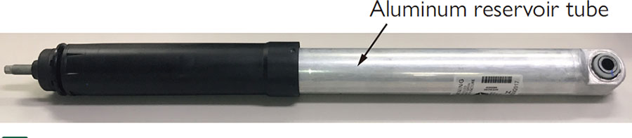 Shock absorber with reservoir tube made from aluminum